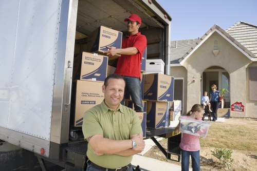 Professional movers handling office furniture in Catford