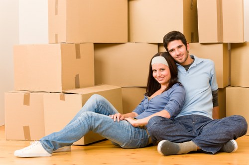 Professional movers handling furniture in Catford
