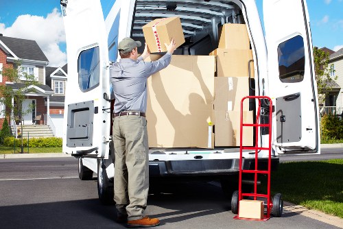 Professional movers handling furniture in a local Catford home
