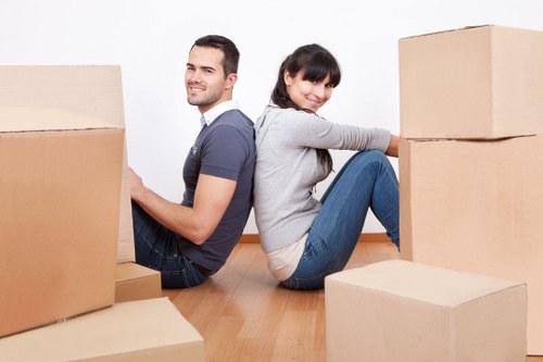 Boxes and furniture arranged in a Catford property during a home move