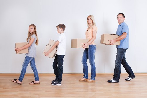 Local team collecting sofas, beds, and wardrobes from a Catford property